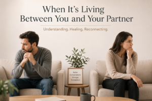 Couple sitting apart during therapy session representing emotional distance and relationship healing through couples counseling.